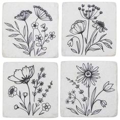 four coasters with flowers drawn on them