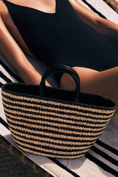 This is not your average raffia bag. Fine craftsmanship elevates our Top Handle Raffia Bag, making it an effortless choice from city to shore. Featuring two Napa leather handles, a zipper closure, and hand-braided raffia - which is locally harvested in the Rwandan countryside. Cesta baskets are handwoven by female artisans in Rwanda, Africa, using locally sourced, renewable resources. Each piece is hand finished in Italy with carefully chosen, sustainable materials. Product Details: 8-12” W x 8” Rwanda Africa, Jenny Bird, Olympia Le Tan, Raffia Bag, Jane Birkin, Basket Bag, Women Artisans, Sustainable Materials, Leather Handle