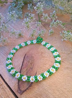 Sweet daisy anklet in green & white colors made from Czech seed beads and silver screw barrel. Looks cute with all summer outfits! This anklet measures 20 cm = 7.87 inches Green Flower Beaded Bracelets For Beach, Green Beaded Bracelets For Summer Gifts, Green Bracelets For Beach Spring Season, Green Bracelets For Beach In Spring, Casual Green Beaded Bracelets For Spring, Green Beaded Bracelets For Beach In Spring, Handmade Green Bracelets For Summer, Green Bohemian Beaded Bracelets For Spring, Green Beaded Anklets For Summer