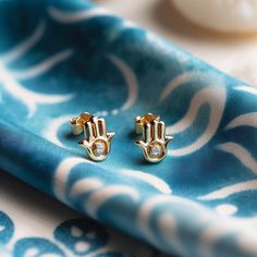 Minimalistic Hamsa earrings  to make you feel blessed and protected handmade in the israeli diamond exchange Gold Earrings Stud, Hamsa Earrings, Hamsa Jewelry, Jewish Jewelry, Earrings Stud, Gold Earrings Studs, Jewelry Handmade, Diamond Studs, Jewelry Earrings Studs