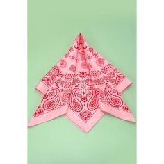 a pink bandana on a green background