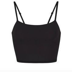 Brand New In Sealed Bag Skims Onxy Color...Black Crop Cami. Adjustable Straps. Soft And Comfy. Cute With Bf Shorts Or Pants In Separate Lising. See Photos For More Details. No Movement In Price On This Item Due To Posh Fees Trendy Black Crop Top With Straps, Black Everyday Crop Top, Bra Friendly, Everyday Black Bra-friendly Crop Top, Black Everyday Bra-friendly Crop Top, Black Bra-friendly Crop Top For Everyday, Chic Black Crop Top With Straps, Elegant Black Crop Top With Adjustable Straps, Black Seamless Strappy Crop Top, Chic Black Crop Top For Everyday