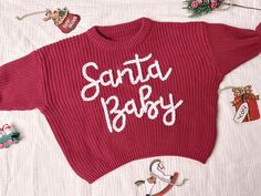 Custom Name Sweater,baby shower gift,Baby Name,Customised Baby Gifts,Newborn Gift,Baby Name Sweater,personalised gifts,christmas-gifts,Christmas baby,baby christmas sweater,my first christmas,christmas romper,santa baby embroider This sweater is comfortable, soft and makes a statement. Each sweater is carefully crafted by our experienced craftsmen using high-quality natural yarns to ensure your baby stays warm and comfortable during the colder seasons. There is an option to add your baby's name Baby Boy Christmas Sweater, Santa Baby Sweater, Baby Sweater With Name, Baby Reindeer Sweater, Baby Christmas Sweater, Christmas Romper, Pull Bebe, Custom Baby Gifts, Unique Sweaters