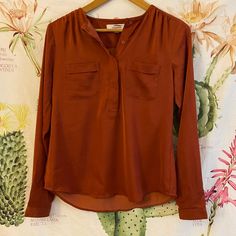 Stylish Burnt Orange Silky Blouse From Ann Taylor Loft. Brand New (Has Been In Storage), Size Xs. Note: There Is A Black Line Through The Brand Name Tag To Avoid Returns. Great Fall Piece! In Great Condition, Has A Couple Of Lines- Barely Visible (The Fabric Is In Fact Intact, Those Lines Might Be Ironed Out, Not Sure). Please Refer To Last Picture- Sold As Is! #Anntaylor #Uo #Madewell Casual Orange Tops For Work, Casual Orange Blouse For Work, Orange Fall Workwear Tops, Orange Tops For Workwear In Fall, Orange Workwear Tops For Fall, Orange Tops For Fall Workwear, Silky Blouse, Ann Taylor Loft, Burnt Orange