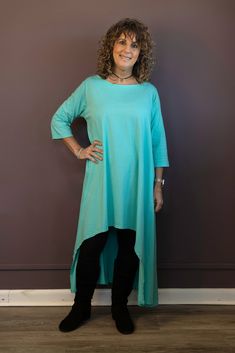 Take your style up a notch with the Hi-Lo Tunic Dress. This versatile dress features a daring high low hemline and 3/4 length sleeves for an edgy look. Wear it as a dress or a tunic with leggings or jeans - the choice is yours! One Size, recommends for sizes 2-14 Armpit to Armpit: 22 1/2", Side Seam Length: 37", Sleeve Length: 15 1/2", Bicep: 14", Length in Front 32 1/4", Length in Back 45" 95% Cotton, 5% Elastane Machine Wash Cold, Tumble Dry Low Tunic With Leggings, Tunics With Leggings, Body Positive, Versatile Dresses, Edgy Look, Sea Green, Boutique Dresses, Full Body Workout, Body Positivity