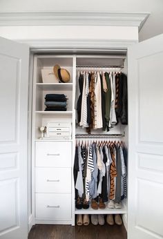 an organized closet with clothes and shoes