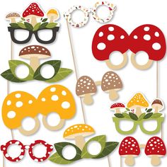 a set of photo booth props with mushrooms and glasses on them for a birthday party