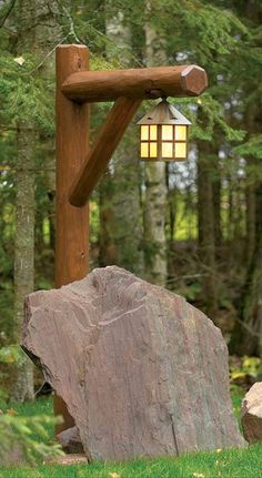 a lamp that is on the side of a rock