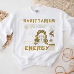 Introducing our Stay Golden Zodiac Sweatshirt: Where astrology meets elegance in a cosmic collision of style! It's a statement piece dipped in stardust and sprinkled with sass, and all the focus on your individual zodiac sign. Embrace your celestial charm and let the world know that you're as rare and precious as gold - and you wear it better! 80% Cotton 20% Polyester Medium-heavy fabric Regular fit  Tear-away label Machine wash: cold (max 30C or 90F); Do not bleach; Tumble dry: low heat; Do not Zodiac Sign Sweaters, Sagittarius Gifts, Horoscope Sagittarius, Zodiac Shirts, Zodiac Signs Sagittarius, Sagittarius Zodiac, Stay Golden, Astrology Gift, Label Machine