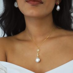 Bronte is a gorgeous mix of timeless classic meets celestial style. She features a pave crystal adorned north star & crescent moon each with a small pearl stone dropped from a gold vermeil chain. Hanging underneath the celestial charms is a large pearl adding a beautiful finishing touch. Bronte would be a perfect choice for lapping up the Summer Sun on a beach somewhere or for a wedding she really is very versatile and if you're looking for something to make a stunning statement then she really Fine Jewelry With Moon Charm For Wedding, Elegant Formal Jewelry With Moon Charm, Elegant Moon Charm Jewelry For Anniversary, Elegant White Jewelry With Moon Phase Detail, Wedding Fine Jewelry Necklace With Moon Charm, Elegant White Moon Phase Jewelry, Luxury Moon-shaped Wedding Jewelry, Crescent Moon Phase Wedding Jewelry, Dainty Crescent Wedding Jewelry