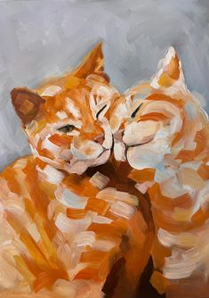 an orange and white cat laying on top of each other