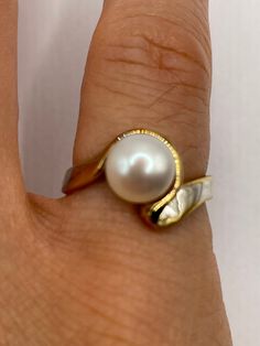 Vintage white cultured pearl  Sterling silver with gold setting   Re sizing has a $20 jeweler's fee. All rings are shipped in a nice gift box.   Check out our over a THOUSAND great reviews Engraving is $4 per letter and is not always perfect depending on the piece. It can take a few days if the jeweler is busy. This is payable to Paypal Judithsltd@gmail.com Formal White 14k Gold Pearl Ring, Gold Pearl Ring Stamped 14k For Gift, Classic Gold Pearl Ring For Anniversary, High Luster Oval Pearl Ring As Gift, White Pearl Drop Ring For Anniversary, Polished Finish Pearl Ring As Gift, Fine Jewelry Pearl Ring With High Luster For Gift, Timeless Pearl White Pearl Ring As Gift, Formal White Pearl Ring With High Luster