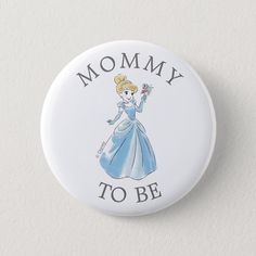 a button that says mommy to be with a princess in blue dress and tiara