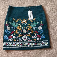 Teal Corduroy Embroidered Skirt. New With Tags. Size Medium. Very Stylish And Well Made. Casual Green Embroidered Skirt, Casual Embroidered Medium Wash Denim Skirt, Casual Embroidered Denim Blue Skirt, Casual Embroidered Denim Skirt, Spring Embroidered Cotton Denim Skirt, Embroidered Cotton Mini Skirt, Blue Embroidered Mini Skirt, Embroidered Fitted Denim Skirt, Casual Style, Mid Calf Skirt