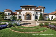 a large white house with landscaping around it