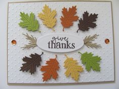 an autumn card with leaves and the words give thanks