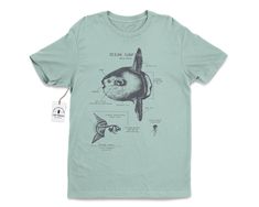 "Wildlife anatomical design of the ocean sunfish that's pressed with hand-mixed inks onto a velvety smooth cotton shirt. The shirt is twined and tagged giving a vintage nautical presentation. Makes a thoughtful gift for any ocean lover in your life. T-shirt stats: * 100% ringspun cotton * Unisex sizing * Shoulder taping * Side-seamed * Pre-shrunk All shirts are silk-screened here in the Life Shines workshop and because of the handmade nature, each t-shirt has a different \"personality\". All ink Marine Biology Shirts, Ocean Sunfish, Anatomy Shirts, Mola Mola, Ocean Shirt, Fish Shirt, Science Tshirts, Beach T Shirt, Vintage Nautical