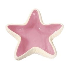 a pink and white ceramic star dish