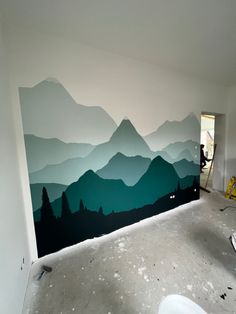 a room with a large mural on the wall