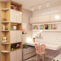 a child's room with pink and white decor on the walls, shelving unit in the corner