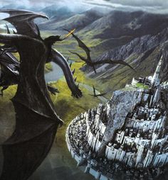 two black dragon flying over a city on top of a mountain