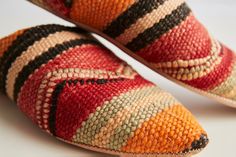 Like snowflakes or fingerprints, no two pairs of our Kilim House Slippers are alike. Each pair will be varied in color and pattern. If you would like to request a particular color tone, please request in notes in your shopping cart. We will do our best to accommodate. Style... Our Moroccan Kilim Slippers are produced in the pointed Arab style that took Parisian fashion houses by storm in the 17th century. ...and Substance Kilim, a Turkish flat-woven style of textile, was first popularized by rug Moroccan Shoes, Moroccan Textiles, Moroccan Fashion, Moroccan Kilim, Arab Fashion, Color Tone, Goat Leather, Clothes Horse, House Slippers