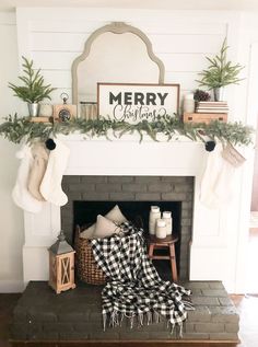 a fireplace decorated for christmas with stockings on the mantle