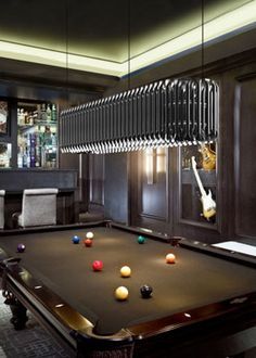 a pool table in the middle of a room