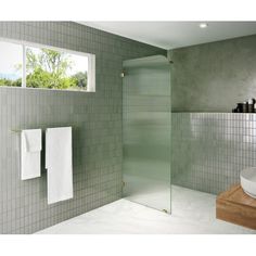 a white sink sitting under a window next to a shower