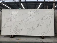 a large white marble slab in a warehouse