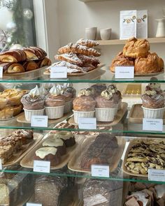 a display case filled with lots of different types of pastries