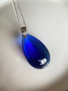 Blue Long Drop Necklace As A Gift, Blue Long Drop Necklace As Gift, Blue Long Drop Necklace For Gift, Blue Drop Necklace For Gift, Blue Drop Necklaces For Gifts, Blue Teardrop Pendant Necklace In Sterling Silver, Blue Sterling Silver Teardrop Pendant Necklace, Blue Teardrop Drop Necklace For Formal Occasions, Formal Blue Teardrop Drop Necklace