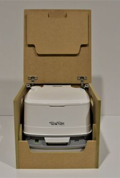 a white toilet sitting inside of a cardboard box