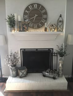 a living room with a fireplace and clock on the wall above it's mantle