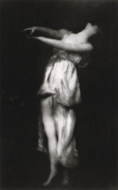 an image of a woman dancing in the dark