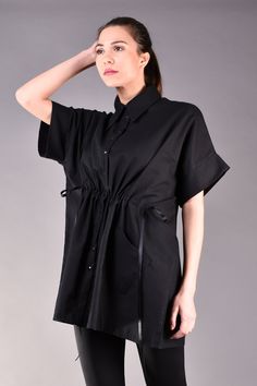 "Linen Shirts, Linen Blouse, Loose Linen Shirt, Linen Clothes. Linen blouse is the perfect choice for the summer as it keeps you cool even though it is black. This oversized shirt is loose fit but can be tightened at the waist thus the body will look more feminine and the waist area will be emphasized. The model features trendy kimono sleeves and a wide collar. It looks very stylish matched with black legging for all black look but added a colour popping handbag or shoes. ^ Sizes: The item can b Oversized Short Sleeve Cotton Blouse, Oversized Cotton Short Sleeve Blouse, Oversized Collared Top For Daywear, Oversized Tunic Blouse For Daywear, Casual Tunic Shirt For Daywear, Black Oversized Tops For Daywear, Chic Short Sleeve Cotton Tunic, Chic Cotton Tunic With Short Sleeves, Chic Oversized Short Sleeve Blouse