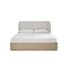 an image of a bed with white sheets and wooden headboard on the bottom side