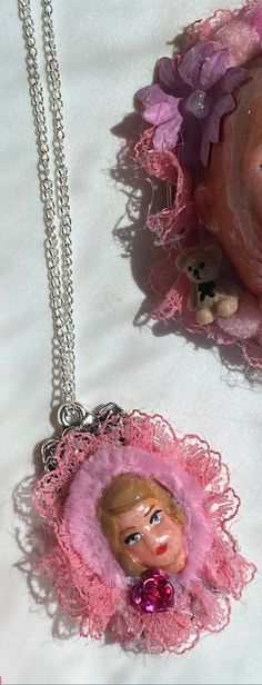 Doll face necklace pretty in pink handmade original wearable art statement jewellery necklace frilly vintage style hand crafted Beautiful handmade doll face necklace. Hand painted and made from start to finish using felt, clay, glaze, paint, findings, cameo setting, fabric and chain. Thank you for your interest in my art Chantelle xoxo Cute Handmade Pink Necklaces, Handmade Pink Pendant Necklace, Handmade Whimsical Pink Necklace, Unique Pink Pendant Necklace, Whimsical Handmade Pink Necklace, Handmade Pink Whimsical Necklace, Handmade Vintage Pink Necklace, Vintage Handmade Pink Necklace, Handmade Rose Flower Pendant Necklace