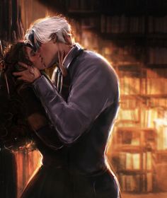 a man and woman kissing in front of a bookshelf