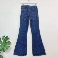 Vintage 70s 684 Orange Tab Dark Wash Levi's//Slim fit/Bellbottom leg. 28" waist, 10" rise, 34" inseam, 33" hips, 31.5" upper hip, 19" thigh, 23.5" leg opening. Will fit a size XXS/23 best imo, maybe a 24 with very slim hips/thighs, but please compare your measurements and ask me questions. Great quality 100% cotton denim and these actually hug your butt! Price firm We ship internationally! SV01888 Spring Retro Mid-rise Flares, Retro Mid-rise Stretch Flares, High Waist Fitted Flares With Five Pockets, Retro Wide Leg Bottoms For Fall, Fitted Flare Jeans With Belt Loops For Fall, Classic Fitted Flare Jeans With Belt Loops, Retro Fitted Mid-rise Flares, Fitted Classic Flare Jeans With Belt Loops, Retro Fitted High Rise Flares