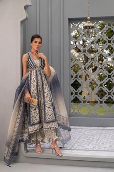 Front open printed jacket with cotton silk printed inner kali that is airy paired here with a printed organza dupatta. Luxury Printed Motifs Dupatta In Traditional Style, Luxury Organza Unstitched Suit For Festive Occasions, Luxury Art Silk Choli With Sheer Dupatta, Luxury Organza Churidar For Women, Luxury Sheer Dupatta Palazzo Set In Organza, Luxury Silk Dupatta With Traditional Patterns, Luxury Art Silk Dupatta With Dabka, Luxury Art Silk Traditional Party Wear, Luxury Elegant Dress With Dupatta