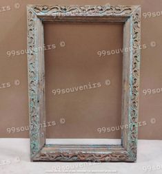 an old wooden frame sitting on top of a table