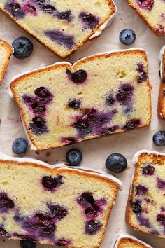 slices of blueberry bread with icing and fresh berries