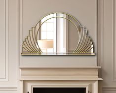 a fireplace with a mirror on the mantle