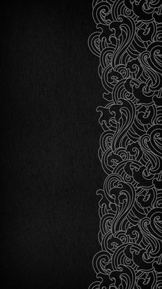 a black background with white swirls on it