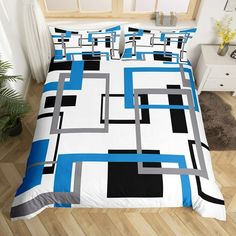 a bed with blue and black squares on it