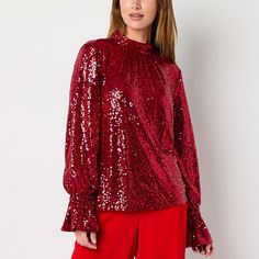 This Bold Elements women's sequinned top comes in a bright red hue perfect for making a style statement at your next party or holiday soiree. It features a high mock neck, long puffed sleeves with flared cuffs and a back button-loop closure. Wear it with jeans or pants and heels. Closure Type: Loop & ButtonFit: Regular FitNeckline: Mock NeckSleeve Length: Long SleeveSleeve Style: Cuffed SleeveApparel Length: 21.5 InchesFiber Content: 95% Polyester, 5% SpandexFabric Description: Mesh NetLining Ma Holiday Soiree, Mock Neck Top, Large Shirts, Long Puff Sleeves, Puffed Sleeves, Style Statement, Bright Red, Mock Neck, Women Long Sleeve