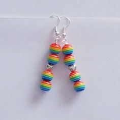 This listing is for one pair of Rainbow Beaded Dangle Earrings. Total length of earrings is approximately 1.5-2 inches. Beads are attached to lead/nickel free silver toned hooks. Earrings come in a colorful organza pouch. Gift box may be purchased if sending as a gift. May also include a note to recipient if desired (no extra charge). Bead Dangle Earrings, Earrings Star, Beaded Earrings Diy, Unique Keychains, Earrings Heart, Rainbow Beads, Rainbow Earrings, Skull Jewelry, Skull Earrings