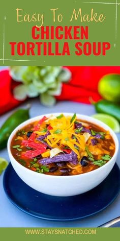 easy to make chicken tortilla soup in a white bowl on a blue plate