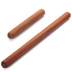 two wooden mallets sitting next to each other on a white surface